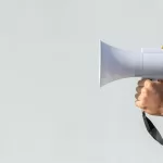 hand-holding-megaphone-protest_23-2148296555