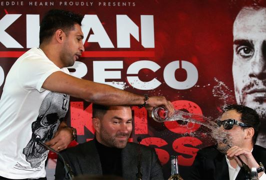 Amir Khan splashes opponent with water at press conference splashes