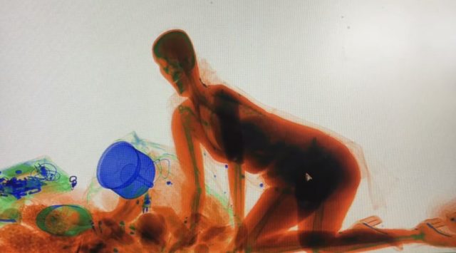 Chinese woman follows handbag into X-ray scanner handbag