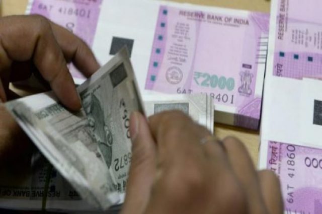 indias-rupee-hits-new-record-low-as-rbi-holds-rates
