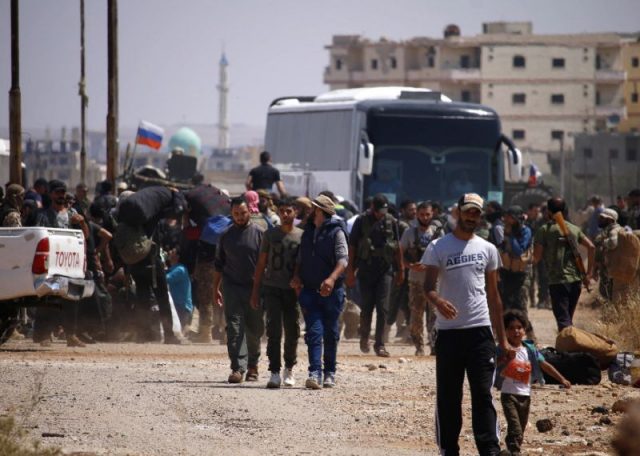 syria-rebels-evacuate-cradle-of-uprising-as-israel-strikes-north