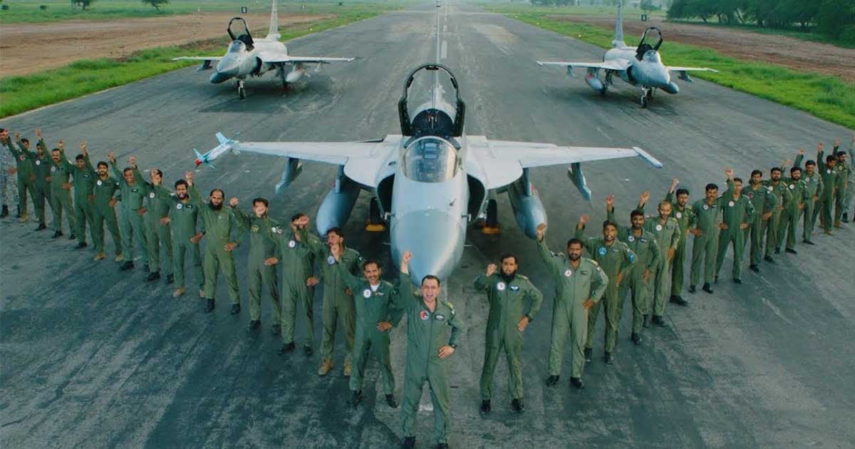 Pakistan Air Force team lined in front of Pakistani fighterjet
