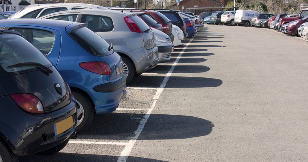 Car Auction (shows cars parked in a parking lot)