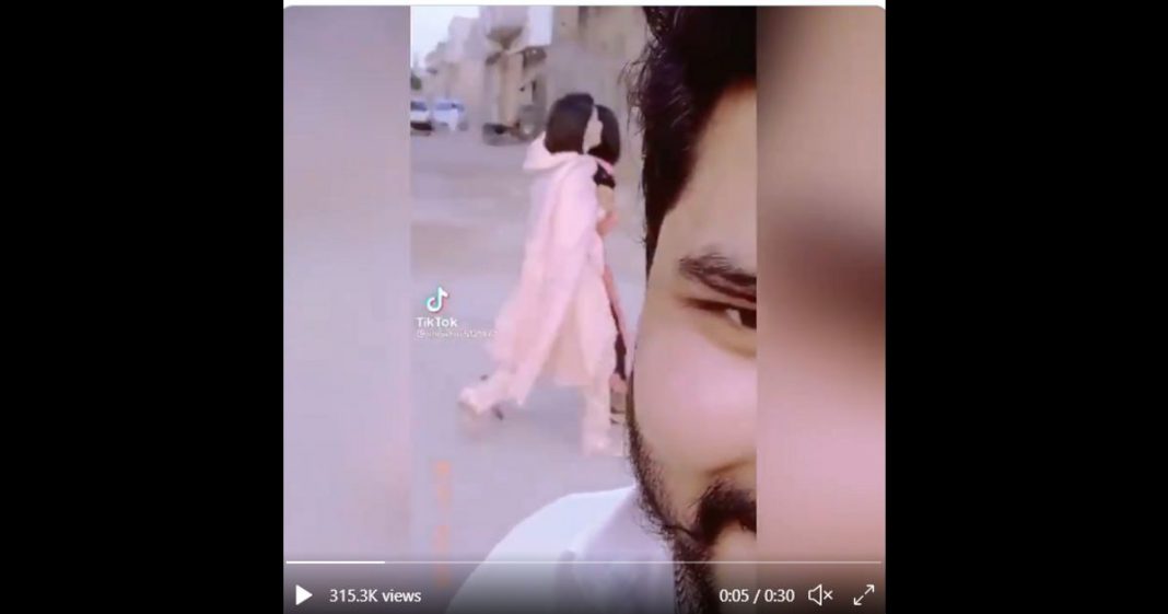 man filming girls TikTok