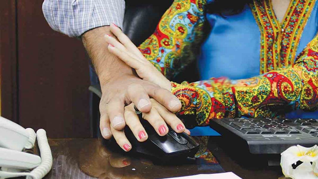 Picture shows harassment of a female victim at workplace