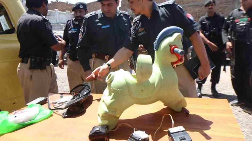 innocent children killed by toy bombs. Shows a toy horse with bomb inside, and police gathered around