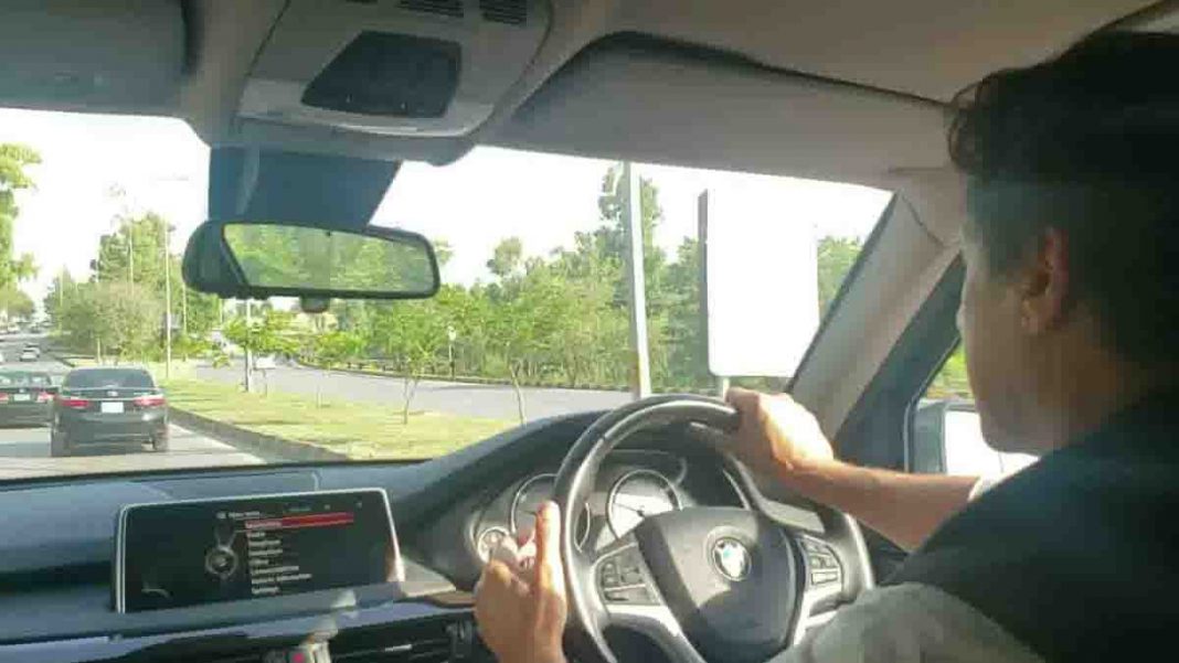 Imran Khan driving around alone