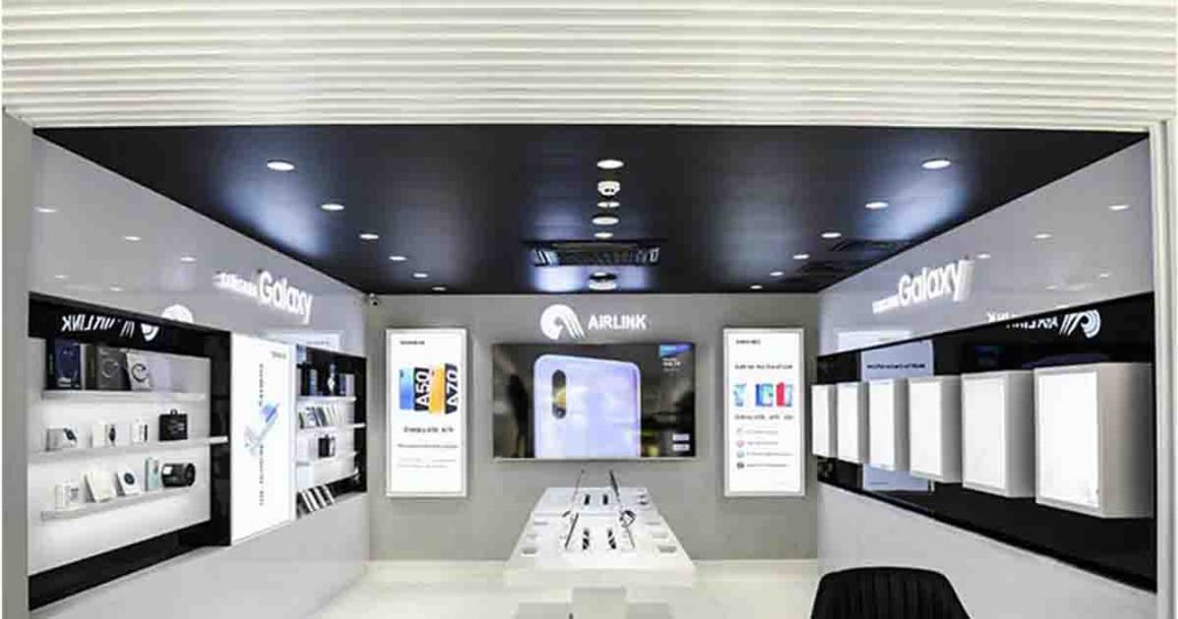Shows Air Link communications mobile store covered in white marble tiles and airlink logo