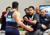 Indian wrestler punching referee