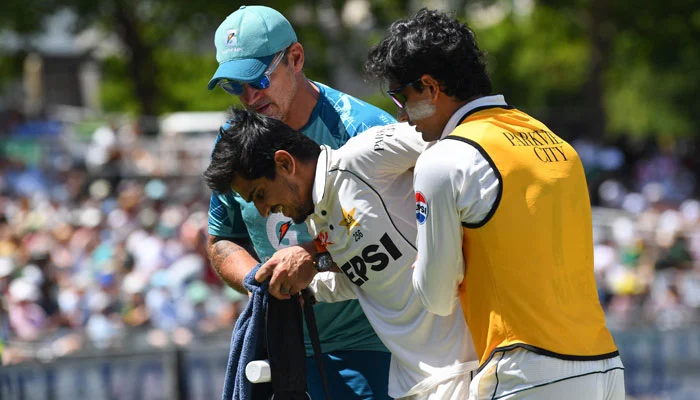Saim Ayub limps off the field