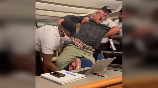 American journalist handcuffed & forcibly removed