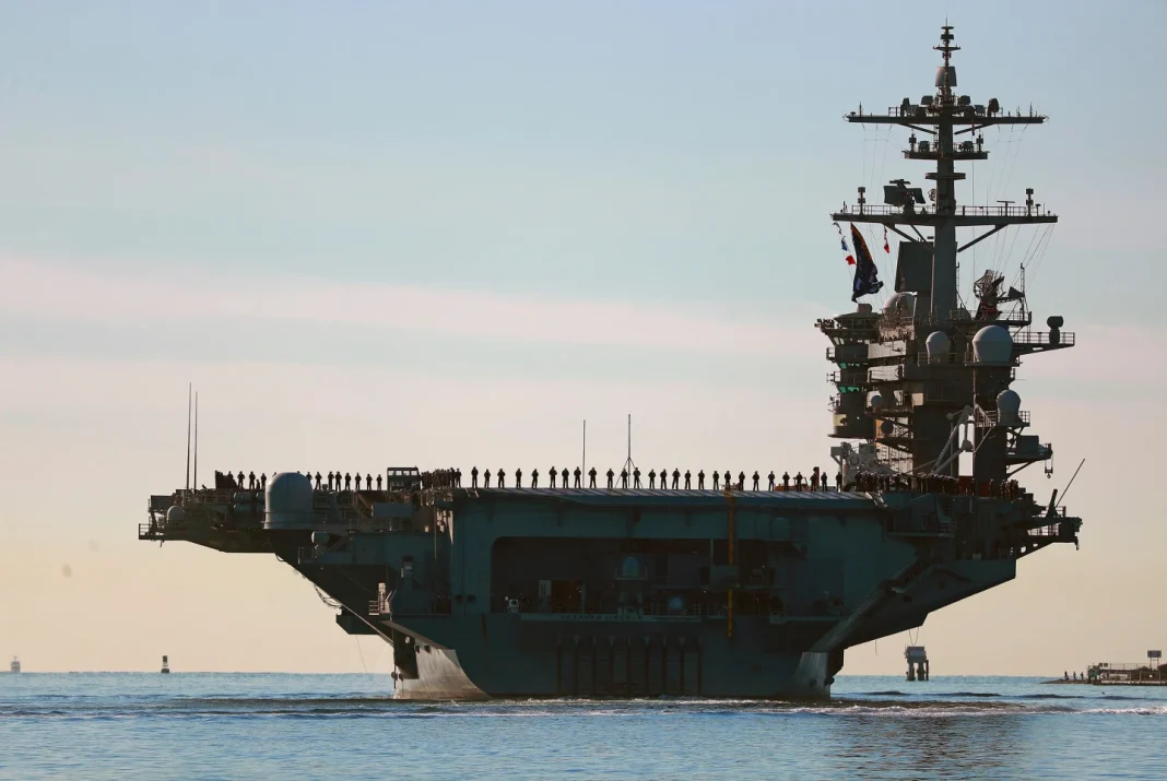 aircraft carrier heads toward Middle East